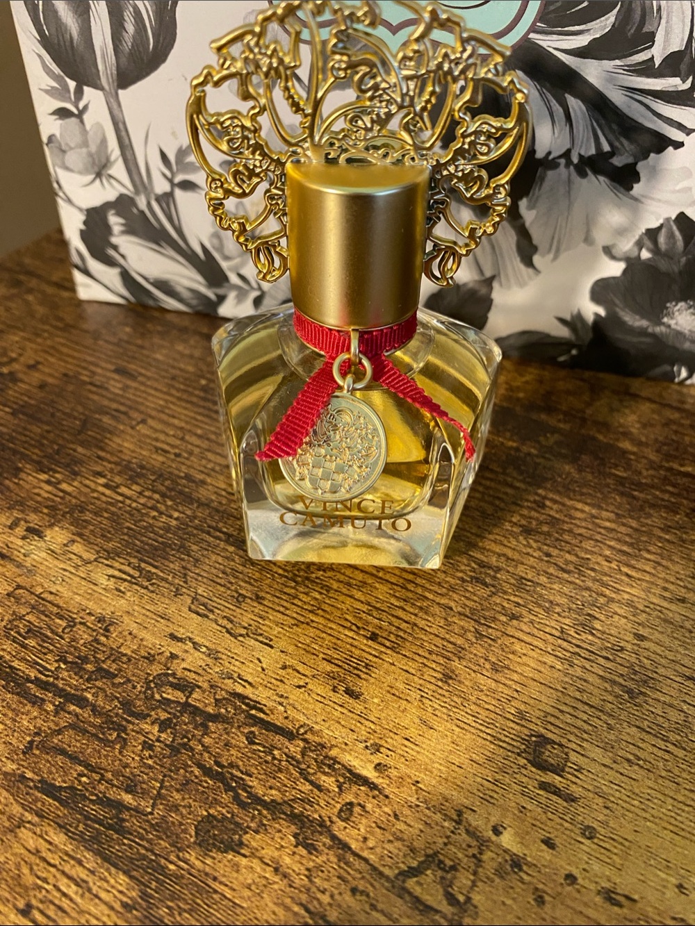 Vince Camuto Gold Perfume Bottle with Red Ribbon Accent
